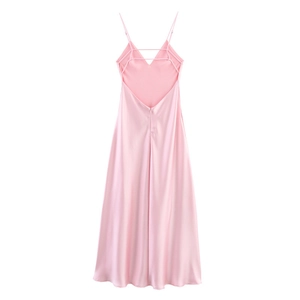 Detail of cross-back straps on a pale pink satin maxi dress with backless design