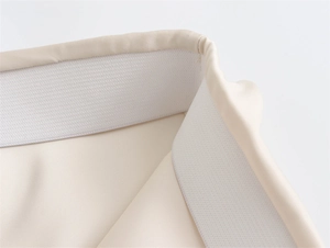 Detail of high-waist elastic band on French style satin skirt with premium stitching