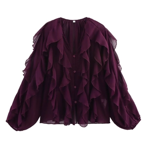 Detailed close-up of layered ruffles and V-neckline on this deep purple chiffon shirt