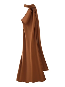 Detail of caramel brown satin halter dress featuring pleated neckline and silky texture