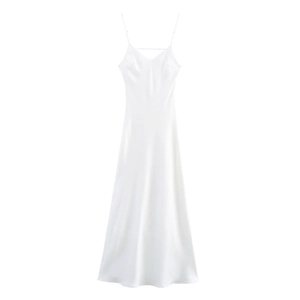 Detailed view of white satin slip dress featuring fine straps and smooth silk-like texture