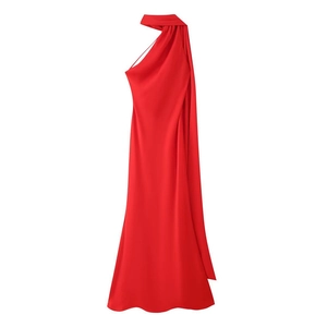 Detail of elegant red halter neck evening dress with draped scarf and cut-out waist