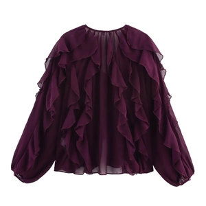 Detail of dark purple V-neck chiffon shirt featuring layered ruffles and lantern sleeves