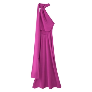 Detail of elegant magenta satin halter neck dress with back cutout and silk-like sheen