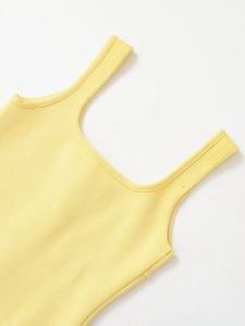 Close-up of square neckline and vertical knit texture on a pale yellow sleeveless top