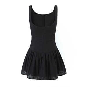 Detail of the back hidden zipper and jacquard texture on this black backless mini dress