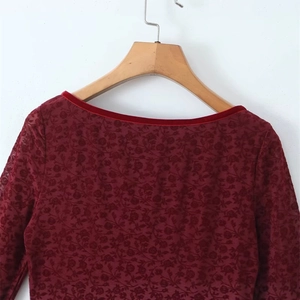 Burgundy long sleeve lace dress featuring rose floral patterns and velvet trim detailing