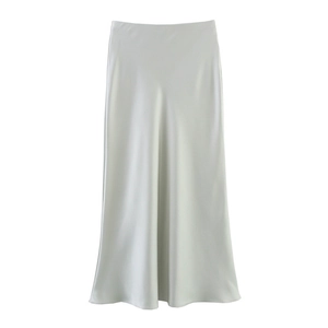 Detail of high-waisted silver satin midi skirt featuring elegant glossy fabric and a-line cut