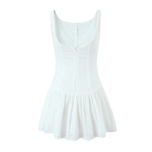 Detailed view of the white floral jacquard fabric and hidden back zipper of this dress