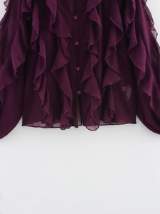 Detail view of deep purple ruffles and button-down design on a lightweight chiffon shirt