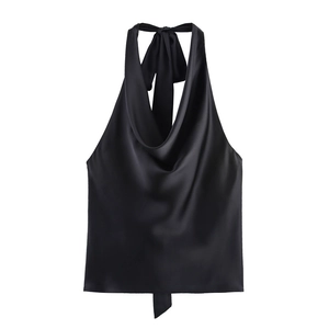 Detail of elegant black satin cowl neck halter top with silky draped fabric texture