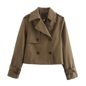 Detail view of khaki double-breasted cropped trench coat with lapel and shoulder epaulettes