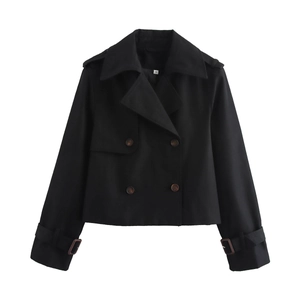 Detailed view of black short trench coat featuring double-breasted buttons and lapel collar