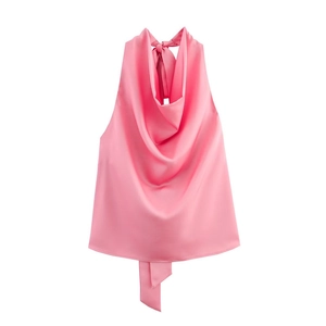 Detailed view of pink satin halter top with adjustable bow tie and elegant cowl neck design