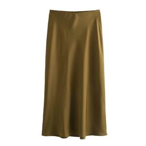 Detail of elegant olive green satin maxi skirt featuring high waist and silky texture