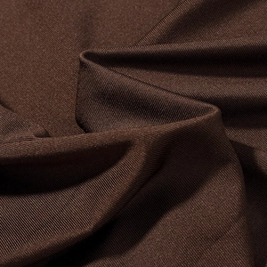 Vue macro de la texture du tissu côtelé marron foncé montrant les détails de couture satin