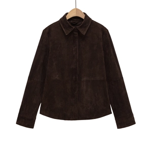 Detail of suede texture and hidden zipper placket on dark brown lapel jacket