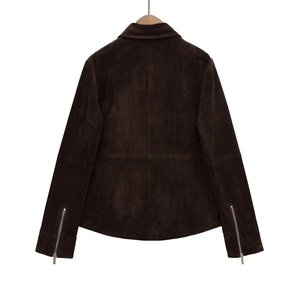 Detailed back view of brown suede jacket with cross stitching and silver cuff zippers