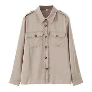 Detailed view of women's satin long sleeve shirt featuring flap pockets and shoulder epaulets