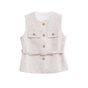 Macro view of beige tweed vest fabric texture with golden thread and embossed metal button