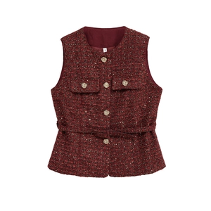 Detailed close-up of wine red tweed vest with golden rose buttons and S-size label