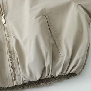 Chic khaki hooded jacket featuring premium metal zipper and ribbed hem details
