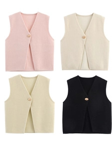 Detail of V-neck knitted vests in pink, cream, beige and black with single button closure