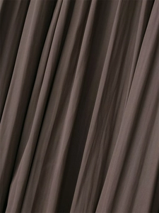 Detailed macro view of dark brown pleated fabric texture with elegant vertical folds