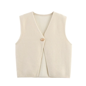 Close-up of creamy knit vest showing fine texture, V-neckline and detailed single button