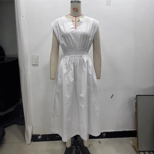 White sleeveless V-neck maxi dress with pleated elastic waist on a display mannequin