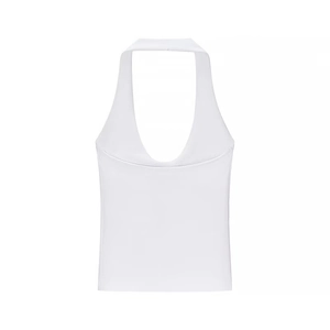 Detail of a white halter neck crop top showing the deep V-neckline and sleeveless design