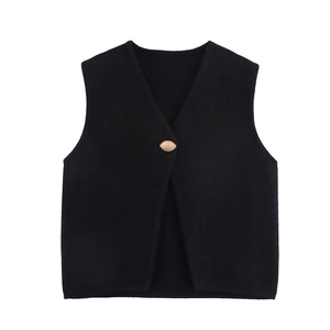 Women's minimalist black V-neck sleeveless knit vest with a single gold olive button