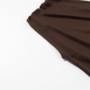 Close-up of the double-stitched seams and ribbed knit texture on the dark brown dress