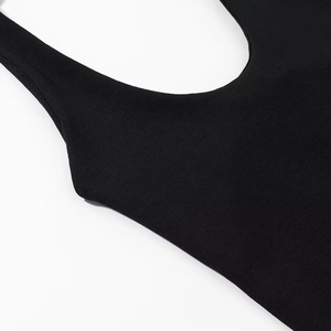 Detail of black halter top featuring premium vertical ribbed knit texture and stitching