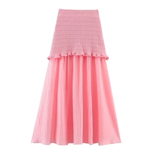 Jupe midi d'été en tricot rose avec volants et empiècements en mousseline plissée