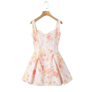 Detail view of pink floral dress with sweetheart neckline and ruffled hem on hanger