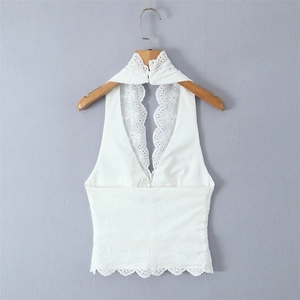 Elegant white eyelet embroidery halter top with sleeveless design and scalloped hem