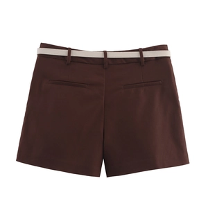 Detailed view of dark brown casual shorts featuring a slim white belt and clean tailoring