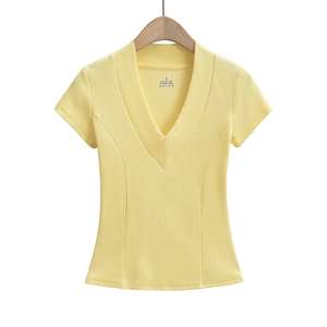 Detail of deep V-neck and ribbed knit texture on a slim-fit yellow short sleeve T-shirt