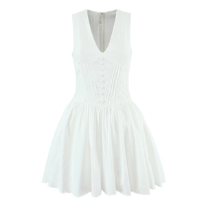 Detail of V-neck sleeveless white dress featuring decorative buttons and corset-style waist