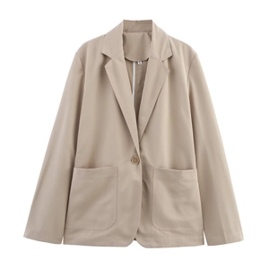 Detailed view of the notched lapel and size S label on light khaki blazer jacket