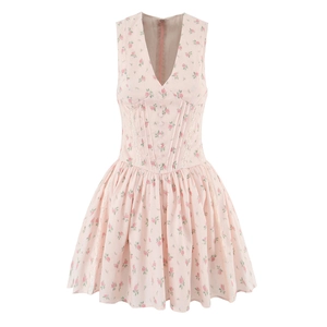 Close-up of V-neck floral dress featuring waist cinching corset style and decorative buttons