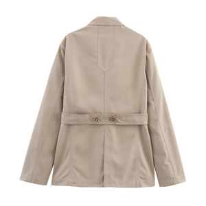 Detail of beige blazer back with decorative waist strap and matching resin buttons