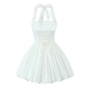 Detailed back view of white halter bubble dress featuring corset lacing and a large bow