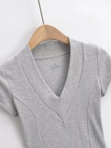Detail of grey ribbed tee showing 46% cotton blend fabric and size S label