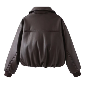 Detail view of the back of a brown faux leather bomber jacket with ribbed hem and cuffs