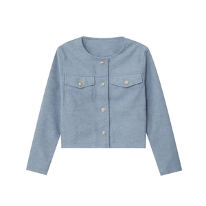 Detail of blue wool blend jacket featuring golden embossed buttons and symmetrical pockets