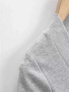 Detail shot of the ribbed knit fabric and reinforced neckline of the grey slim-fit tee