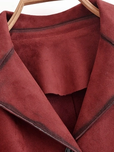 Detail view of the burgundy faux suede jacket collar with reinforced double stitching