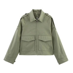Close-up of military green short jacket featuring silver zipper and large utility pockets